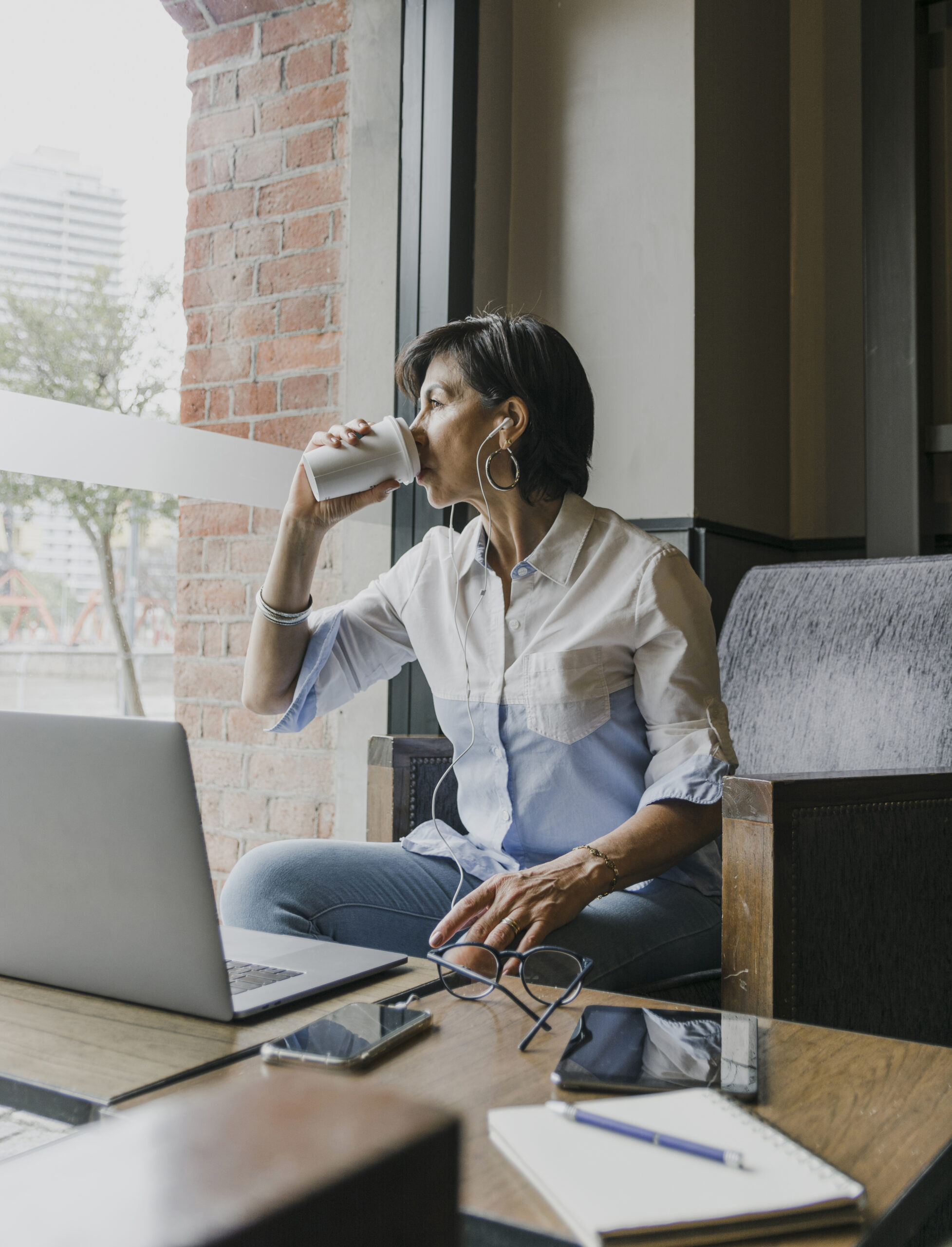 Reversing the Great Retirement &bull; senior drinking coffee her office scaled